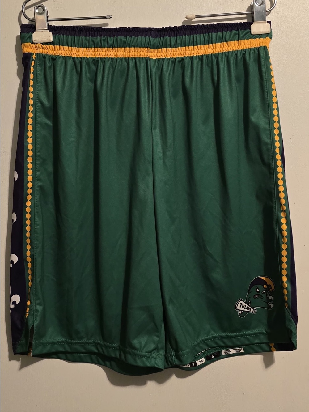 Green Athletic Shorts with Yellow Trim and Team Logo
